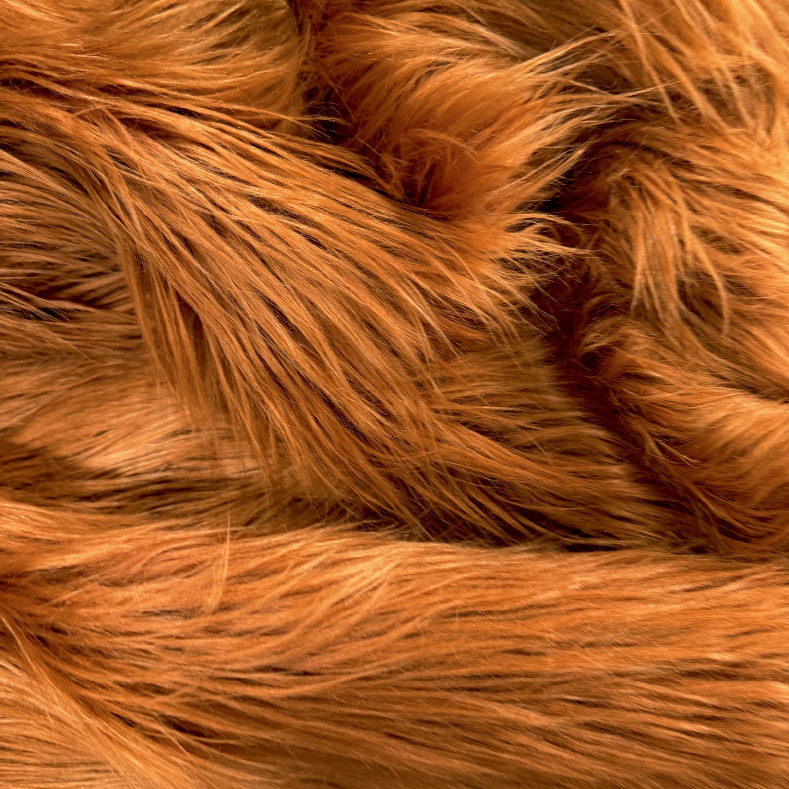 Eden Dark Rust shaggy long-pile faux fur fabric from New Fabrics Daily