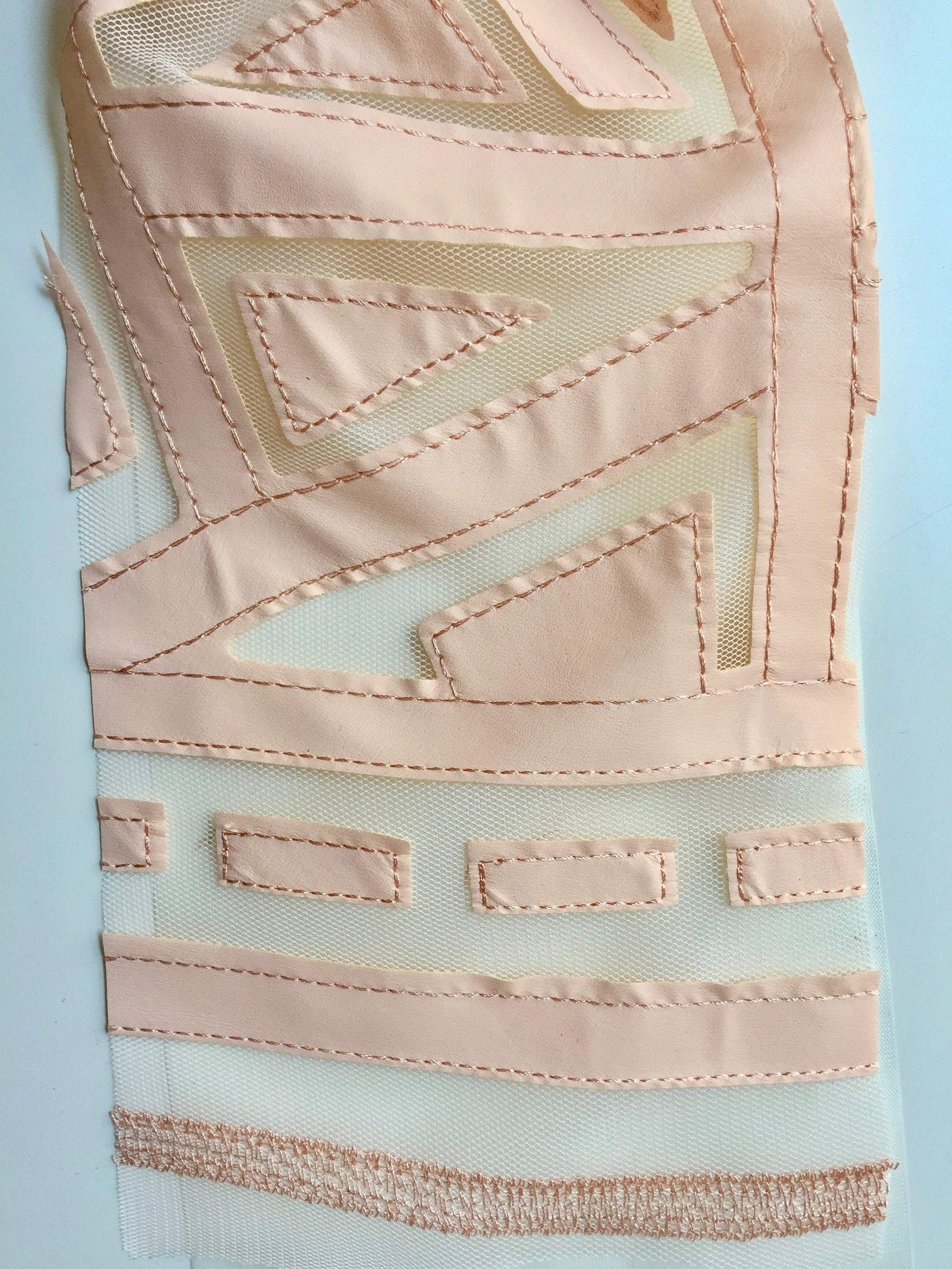 McKinley PEACH Geometric Cutout Vinyl on Mesh Fabric by the Yard - 10105