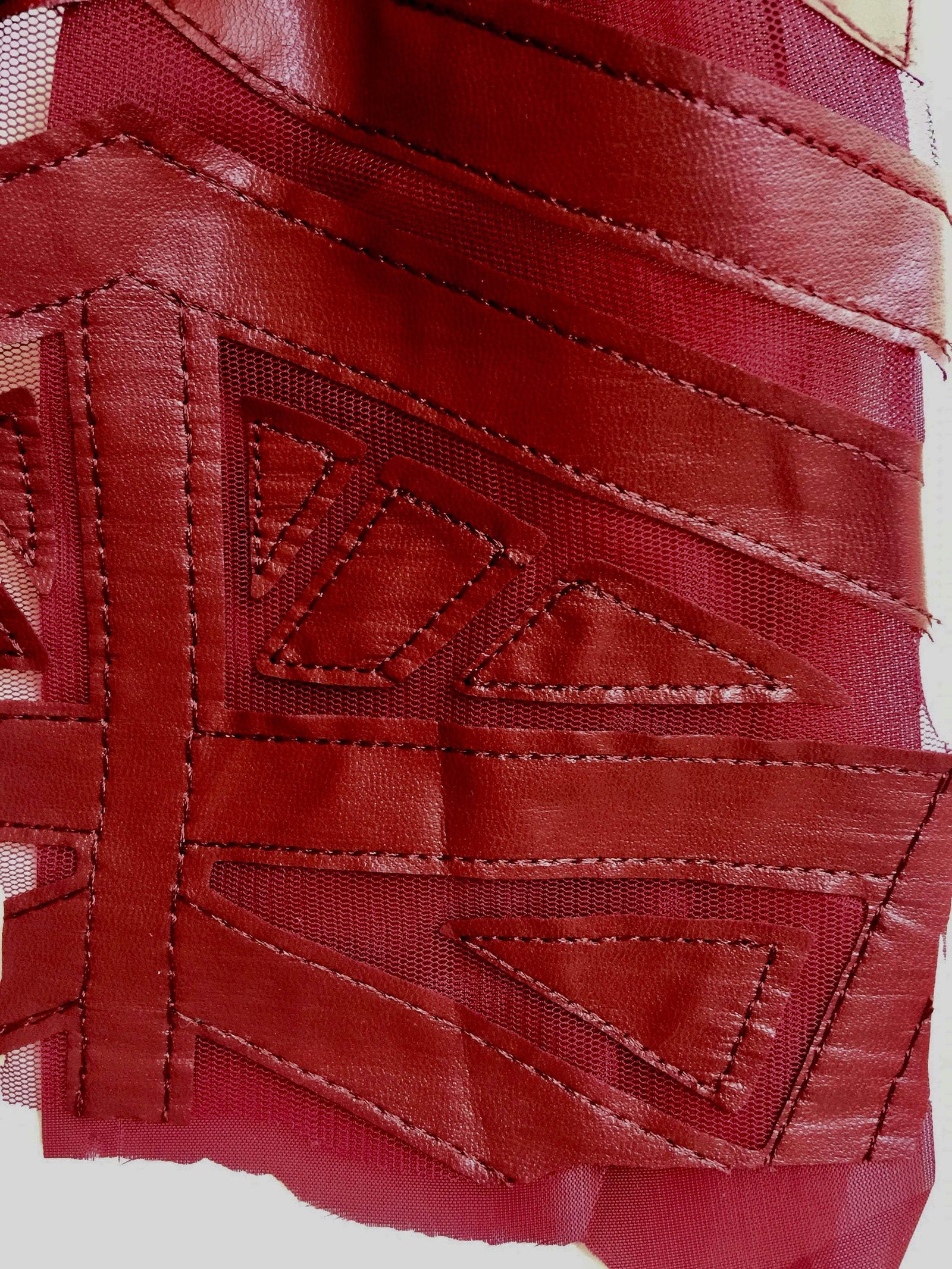 McKinley BURGUNDY Geometric Cutout Vinyl on Mesh Fabric by the Yard - 10105